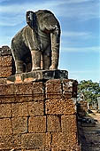 Angkor - Eastern Mebon - monolithic elephants at the corners of the platforms of the pyramid